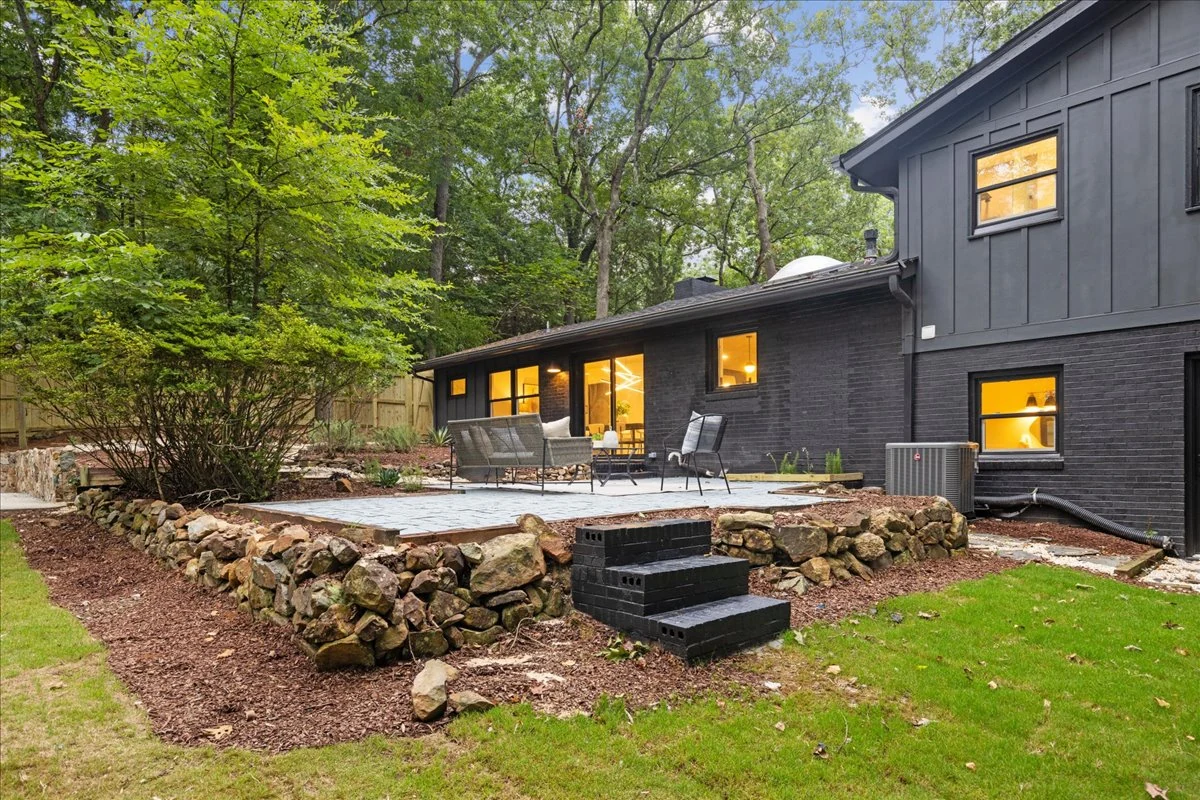 Ridgecrest: dark exterior siding and outdoor patio