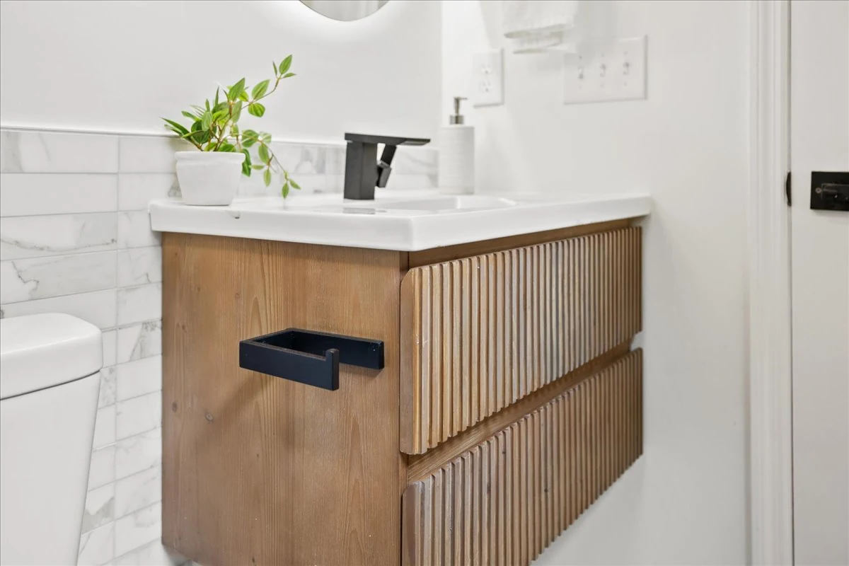 Ridgecrest: fluted vanity and black fixtures